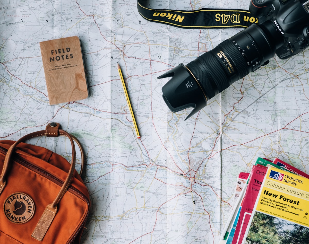 Traveler with backpack looking at mountain landscape — budget travel