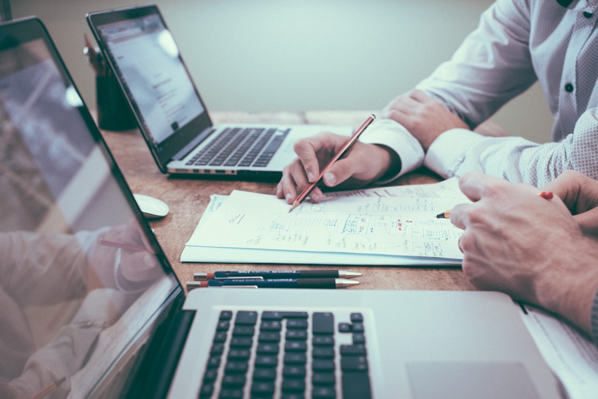 Couple sitting together reviewing household finances at a table