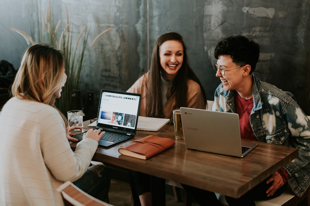Person working from home on laptop as a freelance side hustle