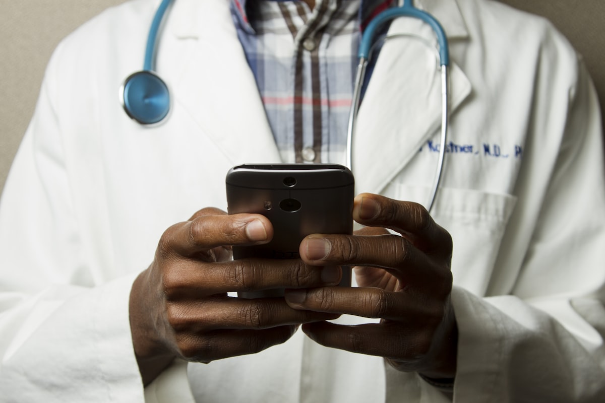 Doctor stethoscope on desk — save money on healthcare medical costs